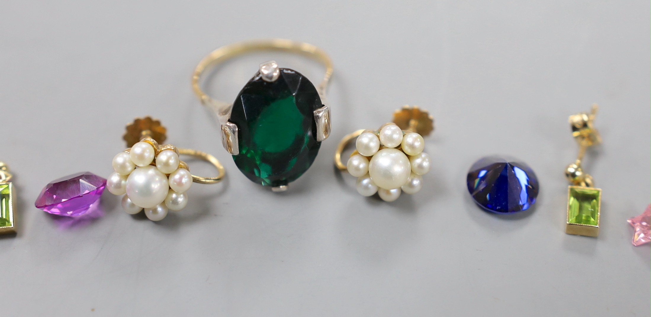 A pair of 9ct and cultured pearl cluster set ear clips, a pair of 9ct and gem set drop earrings, a 9ct and paste set dress ring and six unmounted cut stones.
